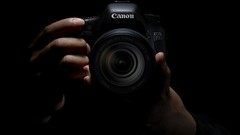 Hands black background Cameras