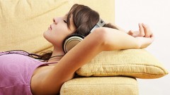 Headphones woman couch closed