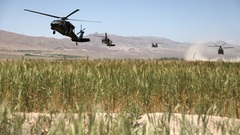 Helicopters fields hills vehicles