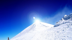 Hills snow sun blue
