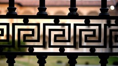 Iron silhouettes fences buildings blurred background