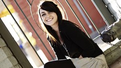 Jumper sitting outdoors smiling long hair brown eyes brunettes 