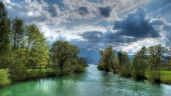Landscapes nature Trees grass snow gray water Mountains clouds 