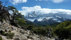 Landscapes nature Trees snow blue Mountains clouds Green rocks 