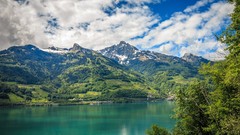 Landscapes nature Trees snow water blue Mountains clouds white 
