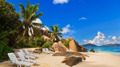 Landscapes ocean chairs palm trees rocks Beaches blue skies