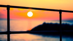 Landscapes Sea sun silhouettes fences blurred background