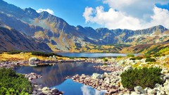 Landscapes stones nature yellow water blue Mountains clouds 