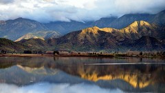Landscapes sunrise nature Trees water clouds hills calm lagoon 