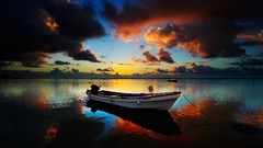 Landscapes sunset nature grass sun Mountains clouds Boats lakes 