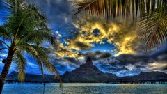 Landscapes sunset nature grass sun Mountains clouds palm trees 