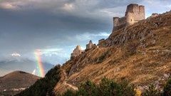 Landscapes sunset nature grass sun Mountains clouds ruins 