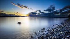 Landscapes sunset nature water clouds coast calm pebbles 
