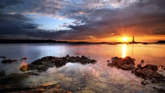 Landscapes sunset Sea stones nature rocks sunlight lighthouses