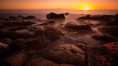 Landscapes sunset Sea stones nature sun rocks Beaches