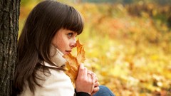 Leaves autumn woman faces sitting brunettes bangs