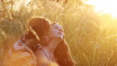 Love couple fields hugging kissing