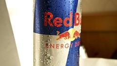 macro Red Bull water drops logo can blue red
