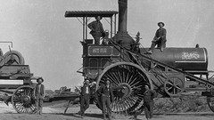 Men monochrome historical old photography steam tractor