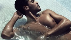 Men tattoos lying down swimming pools male models muscular