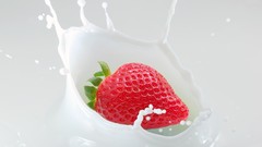 Milk strawberries fruits splashes