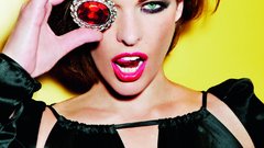 Milla Jovovich yellow background Actress green eyes brunettes 
