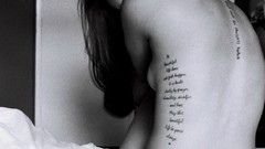 Monochrome tattoos topless