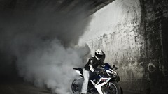 Motorcycles smoke Suzuki burnout