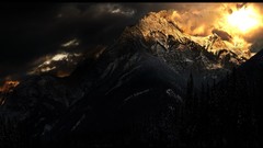 Mountains clouds dark skies forests