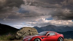 Mountains clouds red cars roads Alfa Romeo vehicles front angle 