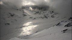 Mountains clouds snow