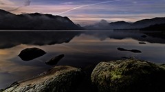 Mountains moss rocks lakes reflections contrails Lake District 