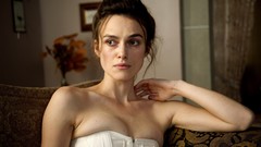 Movies woman Keira Knightley shoulders couch white dress A 