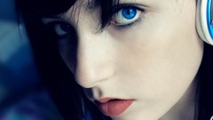 Music headphones close-up blue eyes black hair