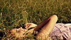 Nature grass woman closed eyes lying down