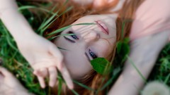 Nature grass woman dress blue eyes lying down