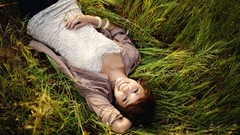 Nature grass woman smiling lying down