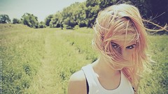 Nature grass woman sunny blondes blowing hair