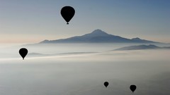 Nature Mountains silhouettes mist hot air balloons