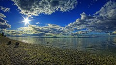 Nature sun clouds pebbles lakes blue skies skyscapes