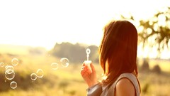 Nature woman bubbles bokeh sunlight blowing bubbles