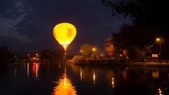 Night crowd rivers hot air balloons