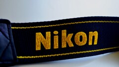 Nikon logo Simple Background yellow