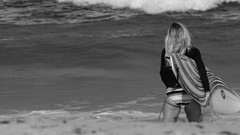 Ocean black and white woman surfing