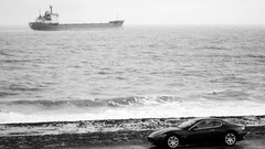 Ocean cars ships shore