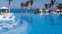 Ocean palm trees swimming pools