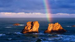 Ocean rocks rainbows skyscapes