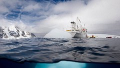 Ocean ships icebergs split-view