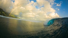 Ocean surfing Tahiti waves rainbows