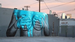 Paint holding boobs mural